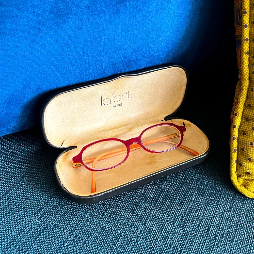 Lacing Paris Glasses. Maroon outside, orange-cream inside. Small frames.